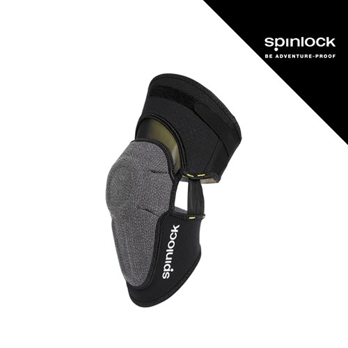 Crni i sivi protektor za koljena veliki, dizajniran za sportske aktivnosti, s logotipom "spinlock" na bočnoj strani.